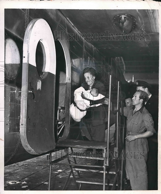 1952 Refugee From East Germany Carries Baby Onto Air - Historic Images