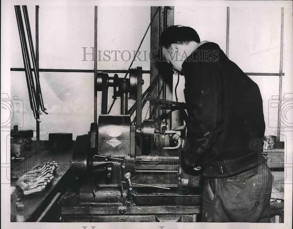 1937 Press Photo Donald Huckle works on an oarlock for a boat - nea90884 - Historic Images