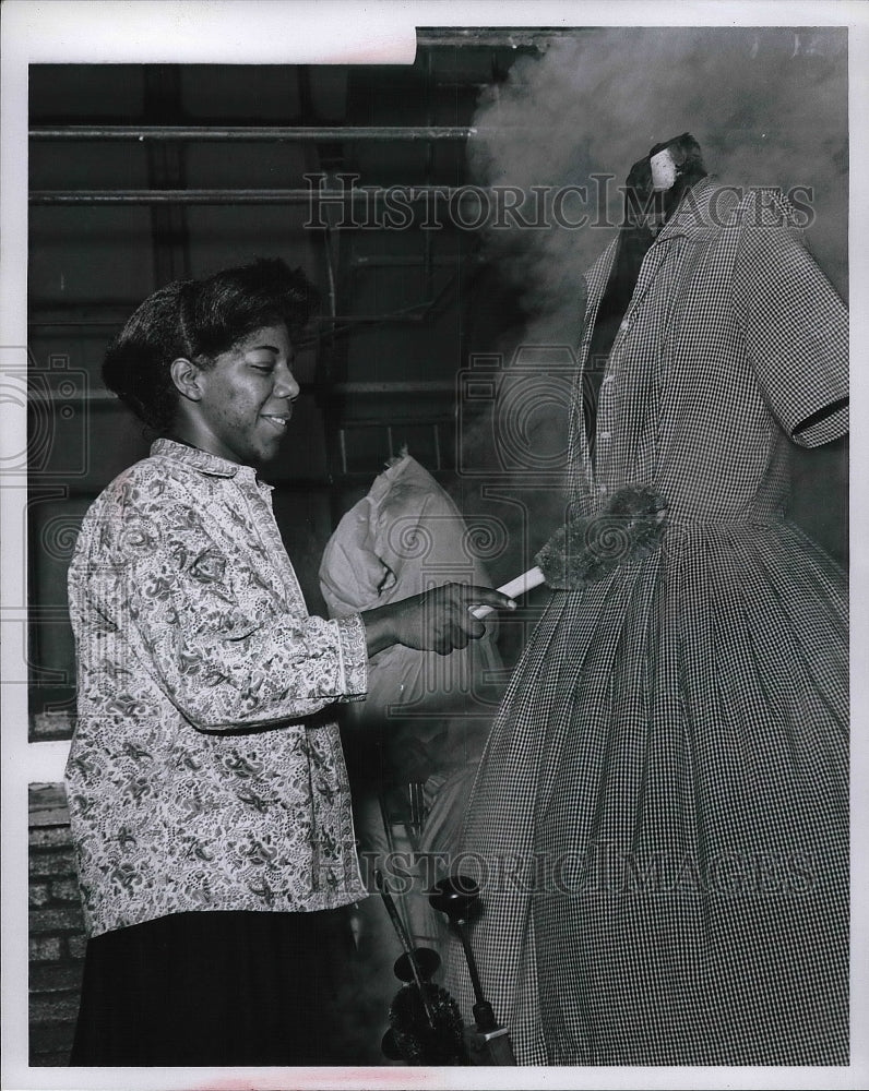 Press Photo Goodwill Worker in Training Presses Clothes With Suzie "Q". - Historic Images