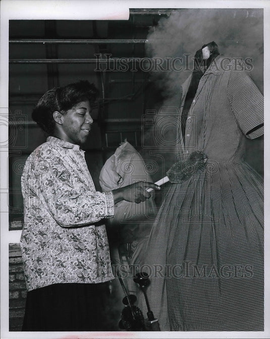 Press Photo Goodwill Worker in Training Presses Clothes With Suzie "Q". - Historic Images