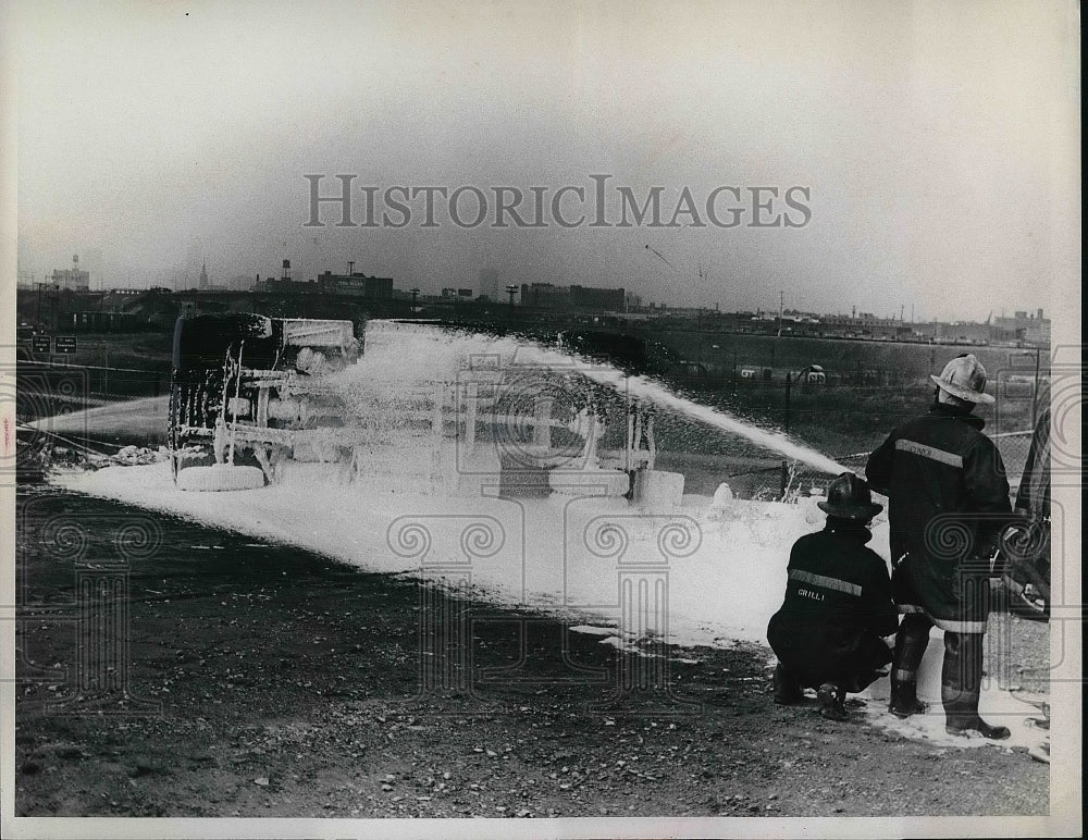 Firemen Using Fire Hose  - Historic Images