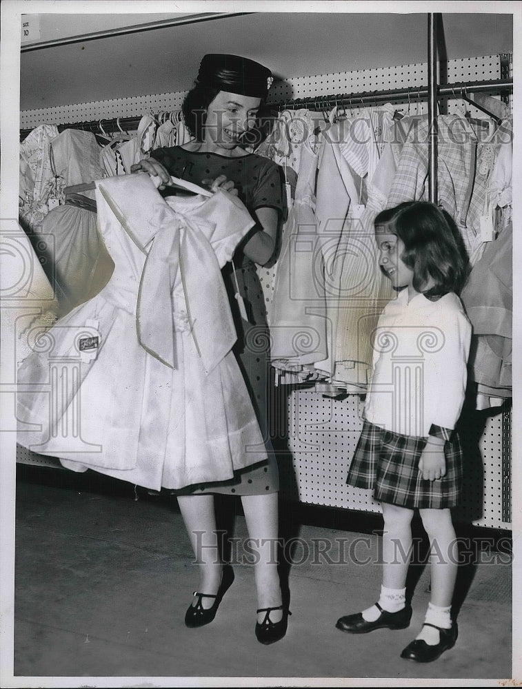 1961 Mrs. Charles Shinola ad Lauretta shopping for children's gown. - Historic Images