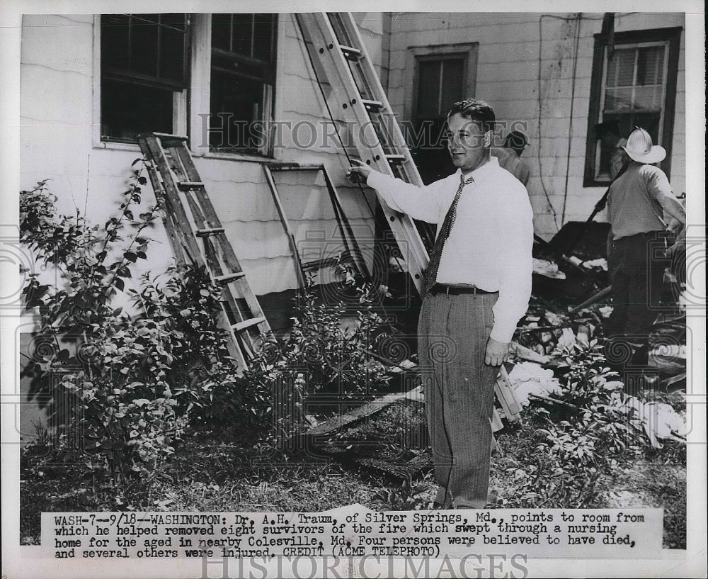1951 Dr A.H. Traum at scene of nursing home fire in Wash. - Historic Images