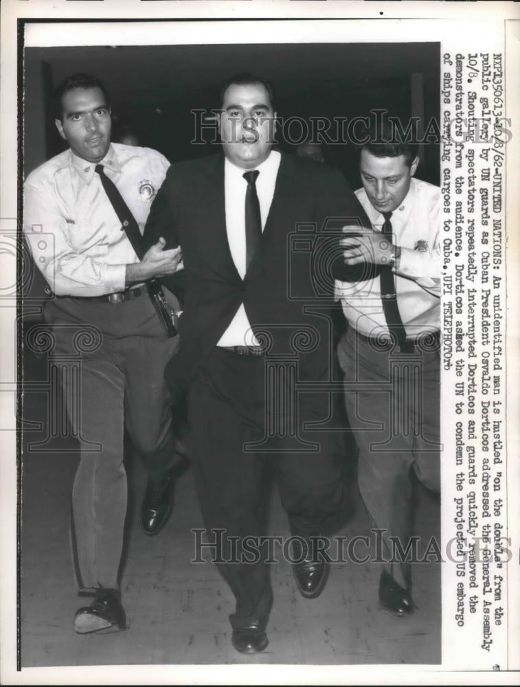 1961 man escorted from UN gallery as Osvaldo Dorticos speaks - Historic Images