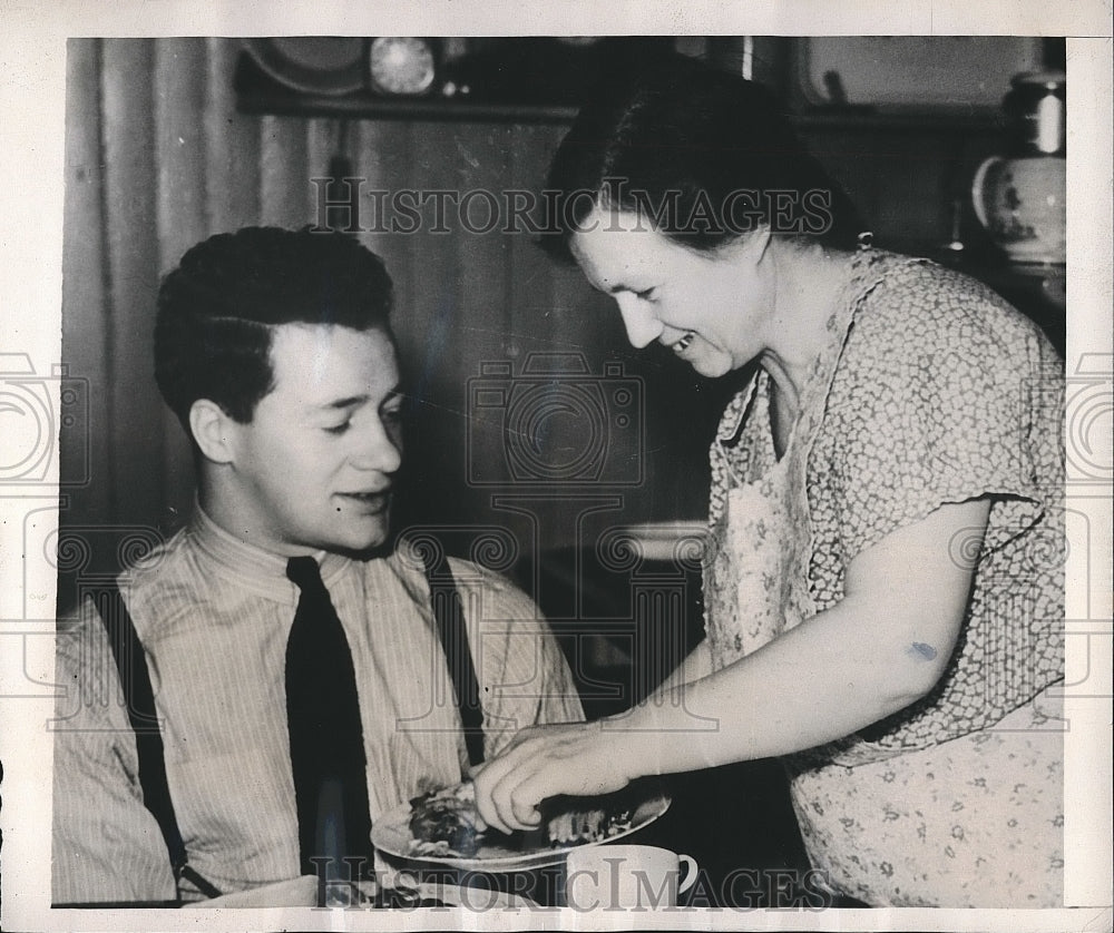 1938 Dick Cassiano,Albany H.S. Athletic Star served by his mother. - Historic Images