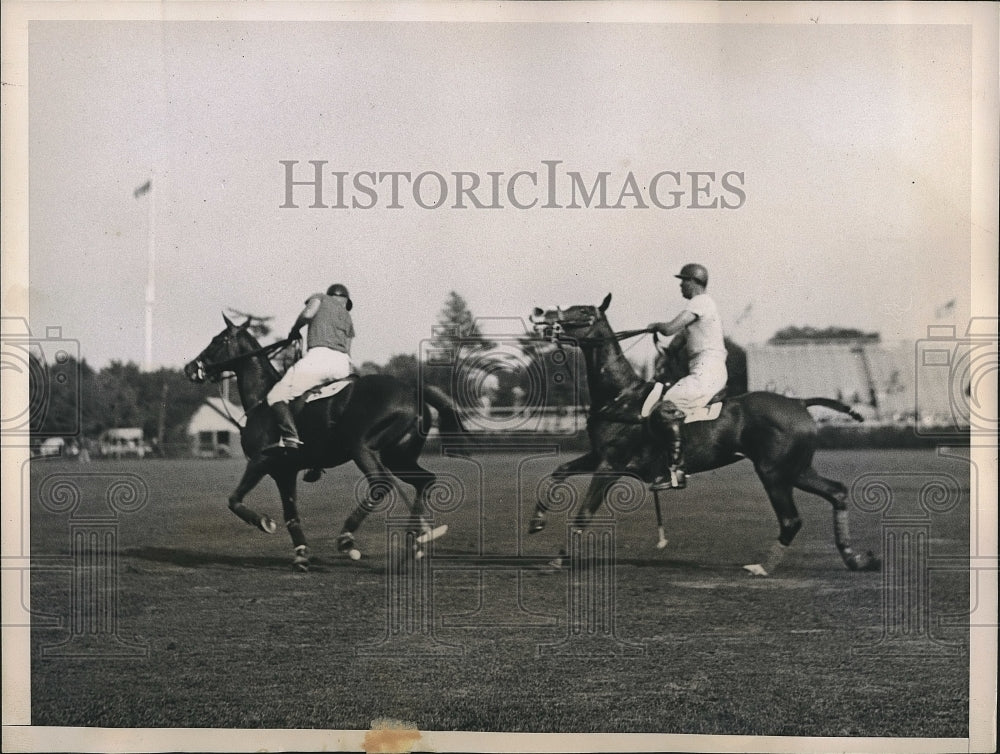 1935 E.T Gerry and Gerry Balding during a polo game.  - Historic Images