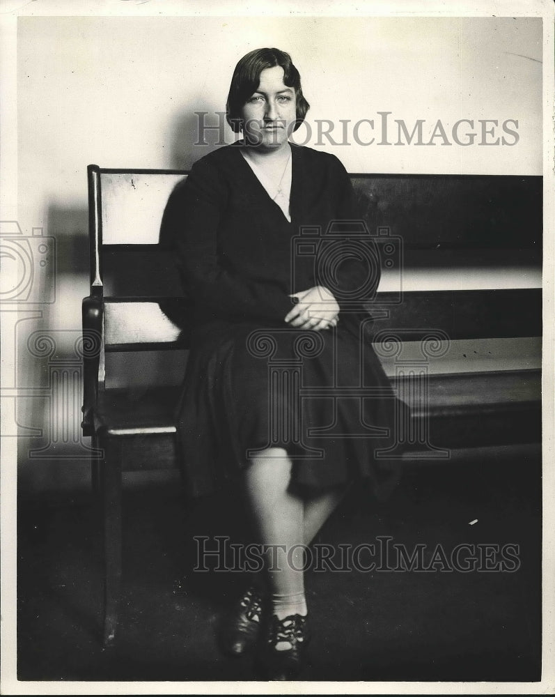 1931 Miss Verda Marshall sitting on a bench  - Historic Images