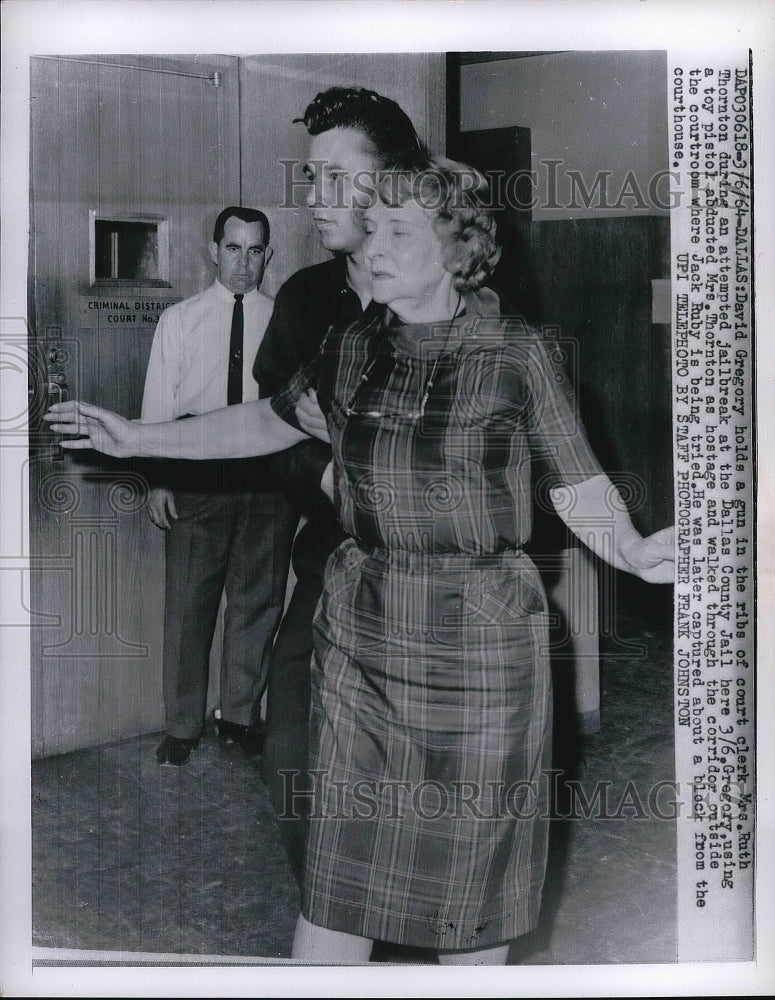 1964 David Gregory Holds gun to Court Clerk Mrs. Ruth Thornton Jail - Historic Images