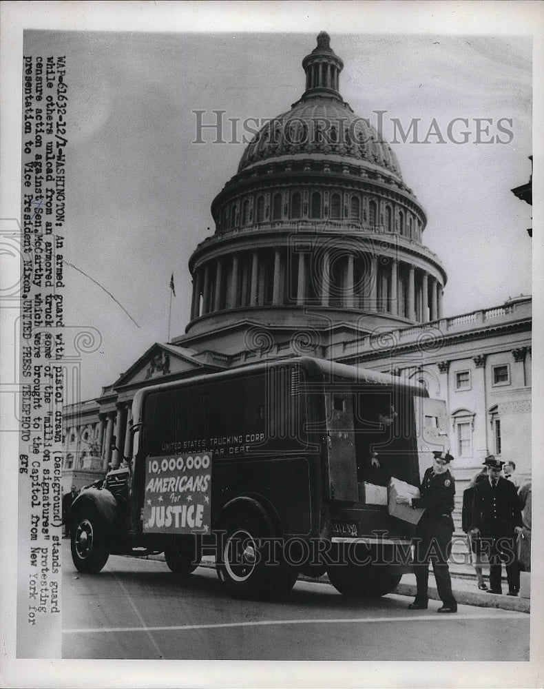 1954 Press Photo Armed Guard With Pistol Drawn Standing Guard To Unload Truck - Historic Images