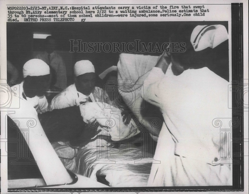 1957 Hospital Attendants Carry Victim From Fire At House  - Historic Images