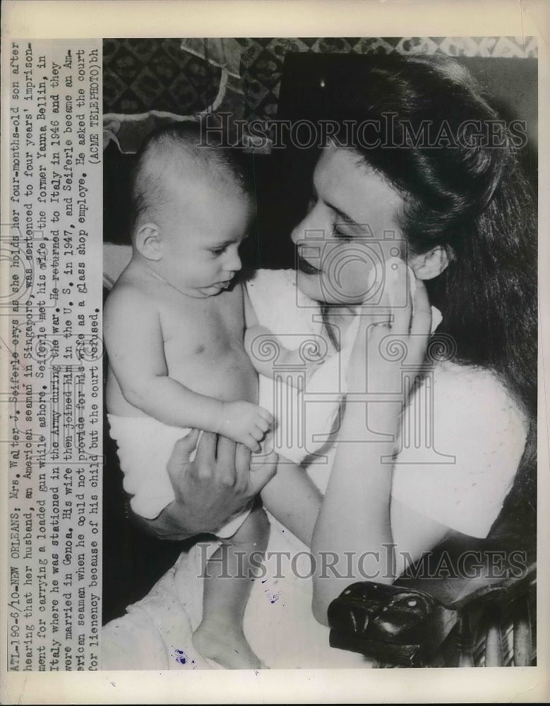 1948 Mrs Walter Seiferle & baby hears husband's in Sinapore prison - Historic Images
