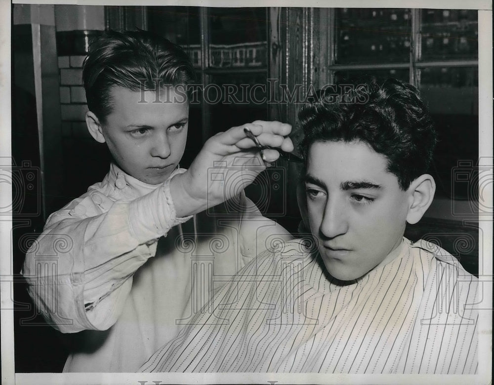 1938 Student barber practices on fellow student - Historic Images