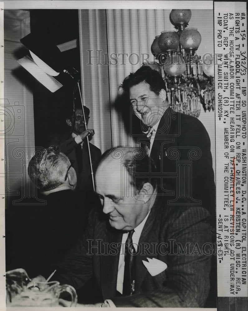 1953 Press Photo Electrician Rights Light After It Falls On Rep. Charles Kersten - Historic Images