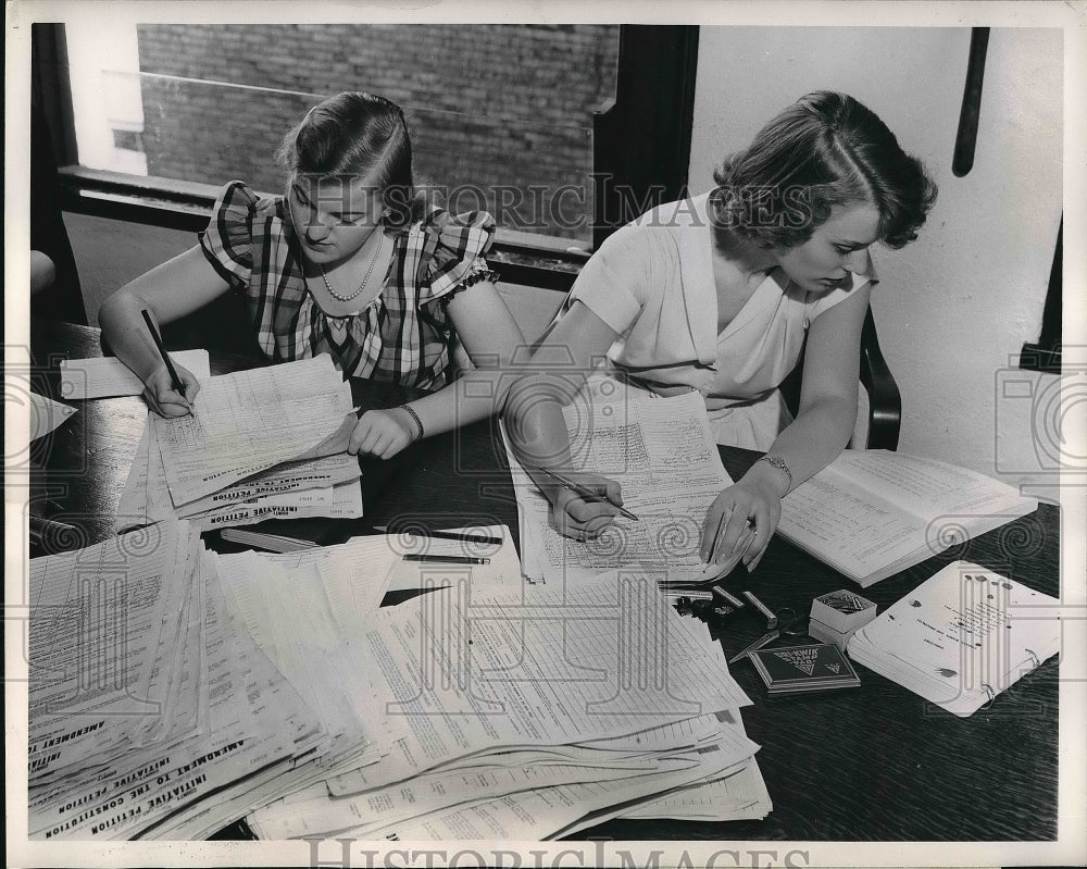 1949 Press Photo Charlotte Clark and Barbara Smith reviewing adoption petitions - Historic Images
