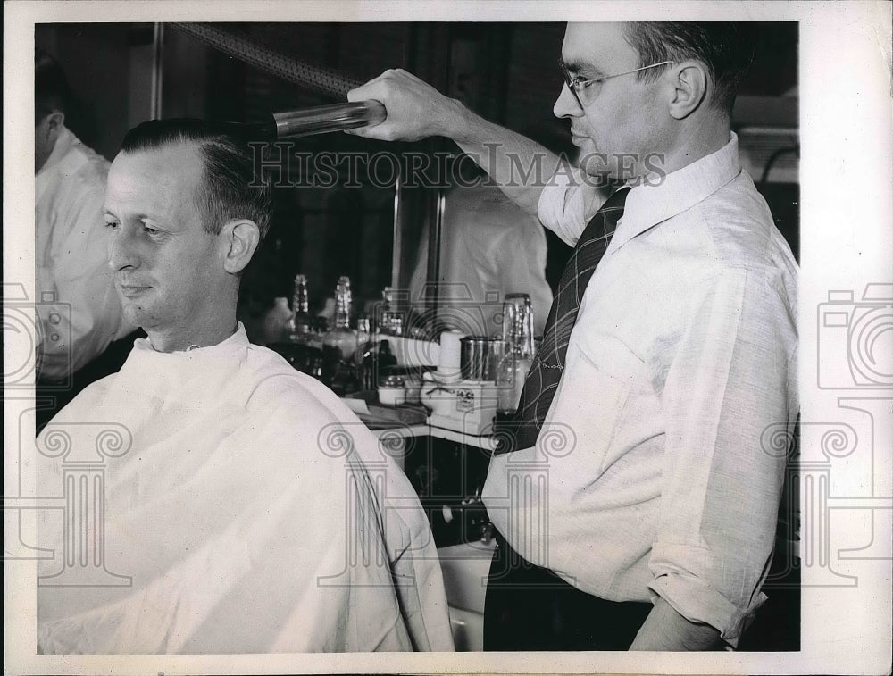 1943 Barber Bernard Kock used Vacuum hose to remove loose hair. - Historic Images