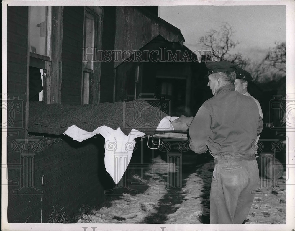 1957 Press Photo Cleveland fire dept & gas leak victims  at a home - Historic Images