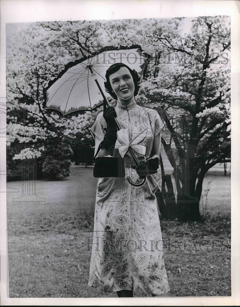 1961 Model Showing Off the Latest Parasol Umbrella Fashions - Historic Images