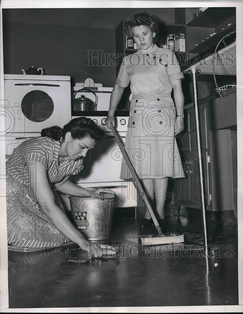 1951 Dolores O'Meara learning housework from Bernice Fash in Women's - Historic Images