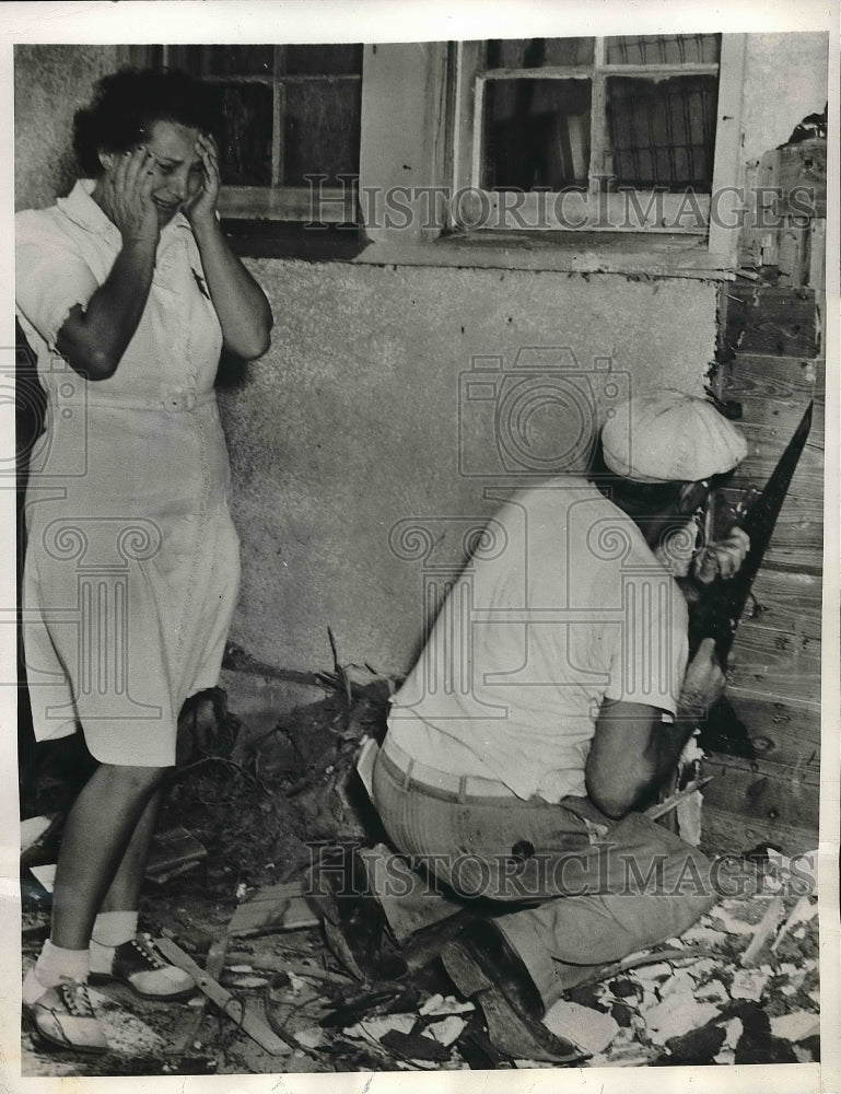1946 Press Photo Louise Osius Watches a Workman Destroy 7 Feet of Her Home - Historic Images