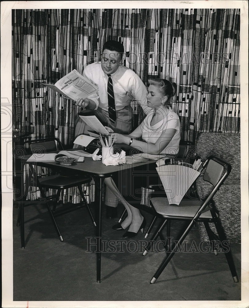 1956 Couples figuring their year income tax statement.  - Historic Images