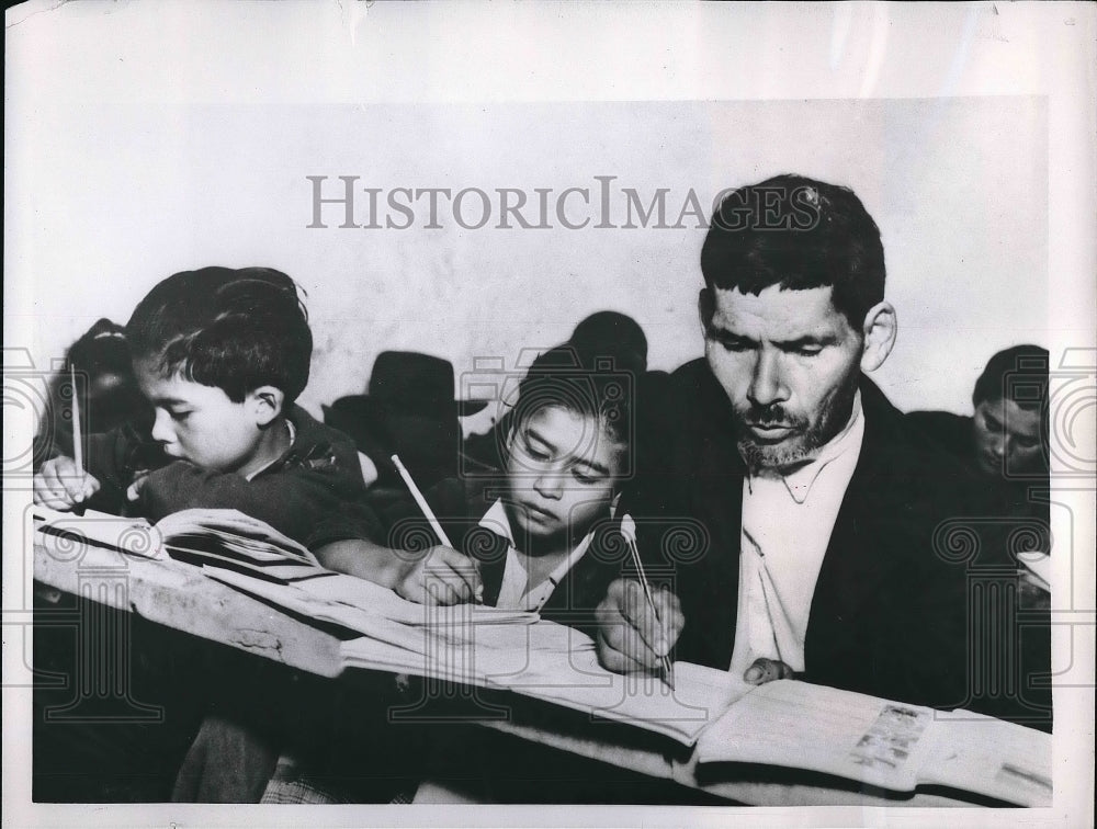 1956 An old man &amp; two kids study in a Columbian school  - Historic Images