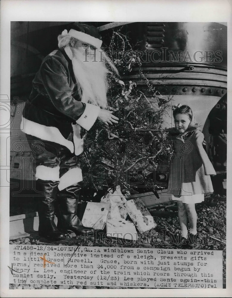 1950 Press Photo Grace Purcell Receives Gifts From Windblown Santa - neb00535-Historic Images
