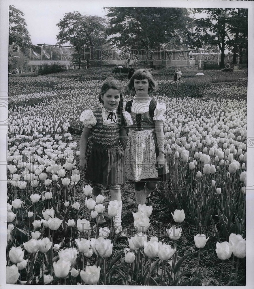 1953 Press Photo Two girls in a sea of tulips at the International Garden - Historic Images