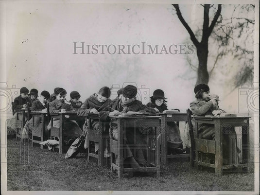 1936 Despite freezing temperatures, students at Regent School in - Historic Images