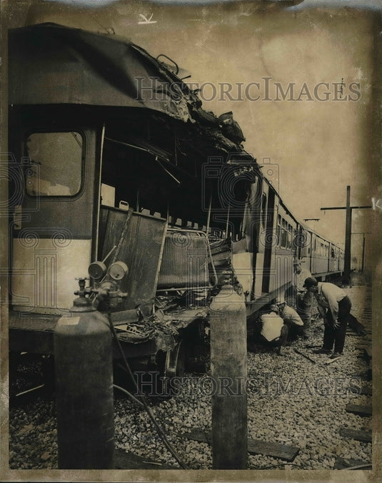 1973 Investigators looking at the wreckage of a train after crash - Historic Images