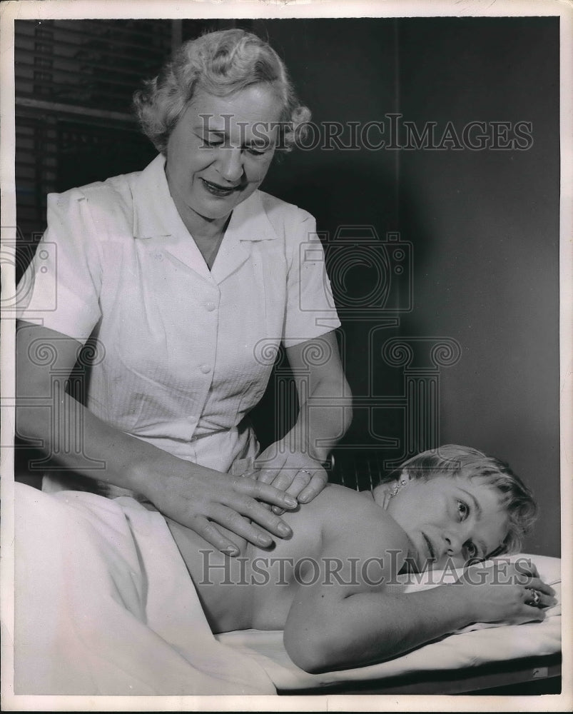 1955 Masseuse Eugenia Lindquist at work - Historic Images