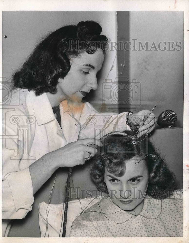 1957 Press Photo Subject Gets Electrodes Attached To Her Head-Historic Images