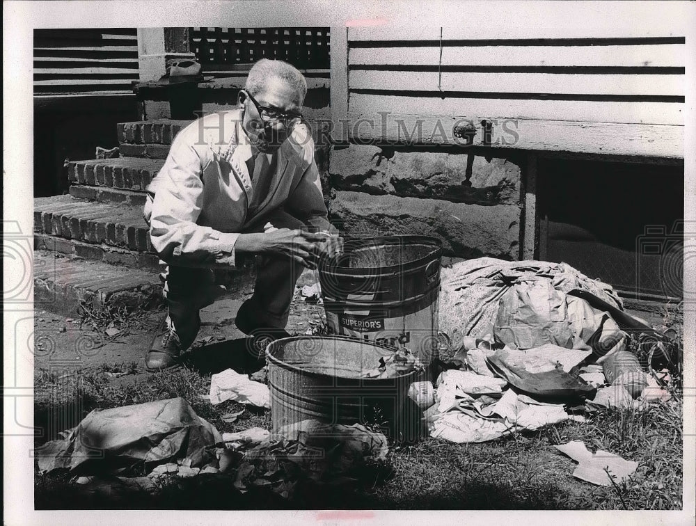 1966 Jesse Roper next to trash at 10524 Kimberly Ave. Cleveland OH - Historic Images