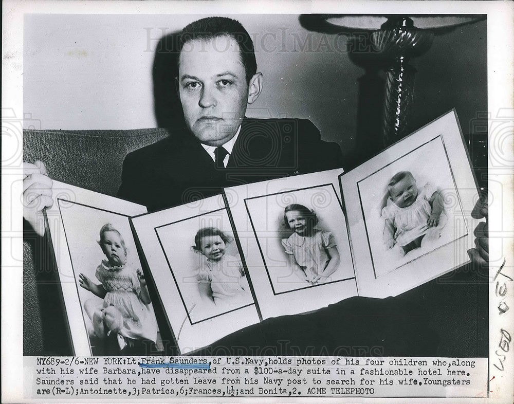 1951 Press Photo Lt. Frank Saunders of U.S. Navy with Photos of Missing Family - Historic Images