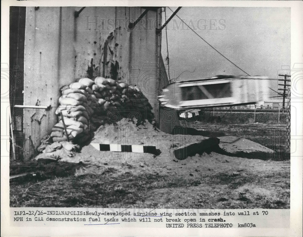 1954 Press Photo Airplane Wing Section Smashed into Fuel Tank in Indianapolis - Historic Images