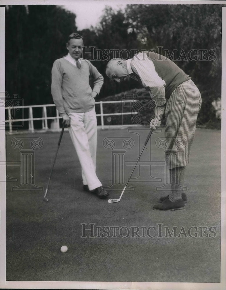 1935 J.M. Patterson and C.M. Robertson playing golf  - Historic Images