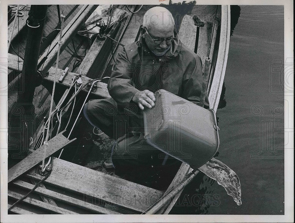 1963 Andrew Bryce of Edgwater Yacht Club Bailing Water Out of Boat - Historic Images