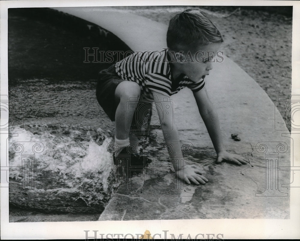 1957 Press Photo Four Year Old Timothy Johnson Jumps Into Fish Pond To Cool Off - Historic Images