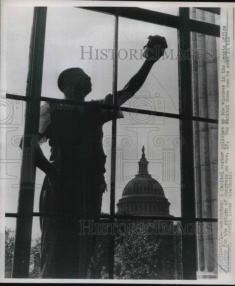 1947 A Capitol worker polishes the windows for start of Congress - Historic Images