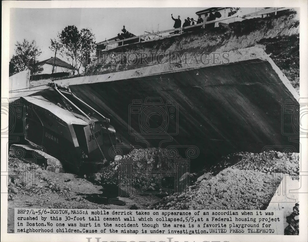 1952 Press Photo Mobile derrick crushed by 30-foot tall cement wall in Boston - Historic Images