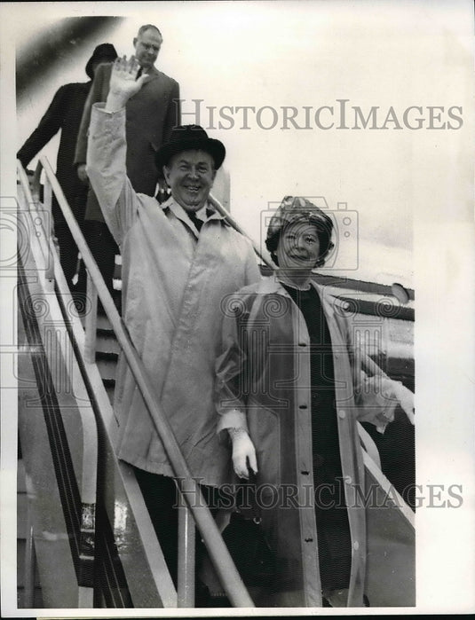 1963 Prime Minister Lester Pearson and his wife arriving in London - Historic Images