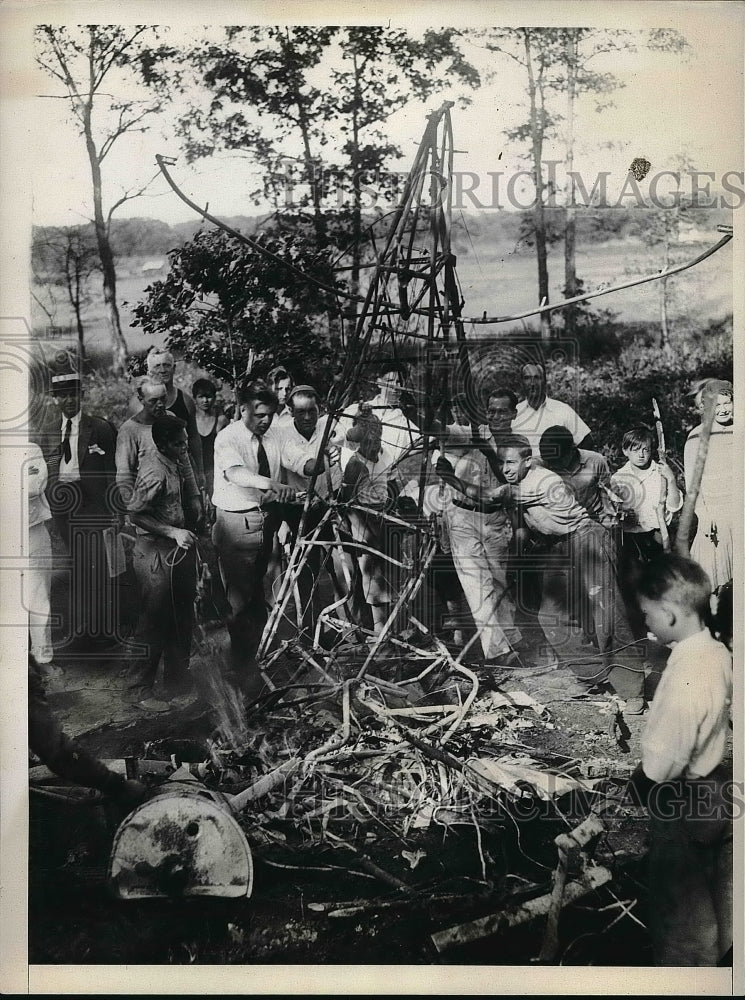 1930 The remains of a crashed plane in a open field in Caro, Ill. - Historic Images