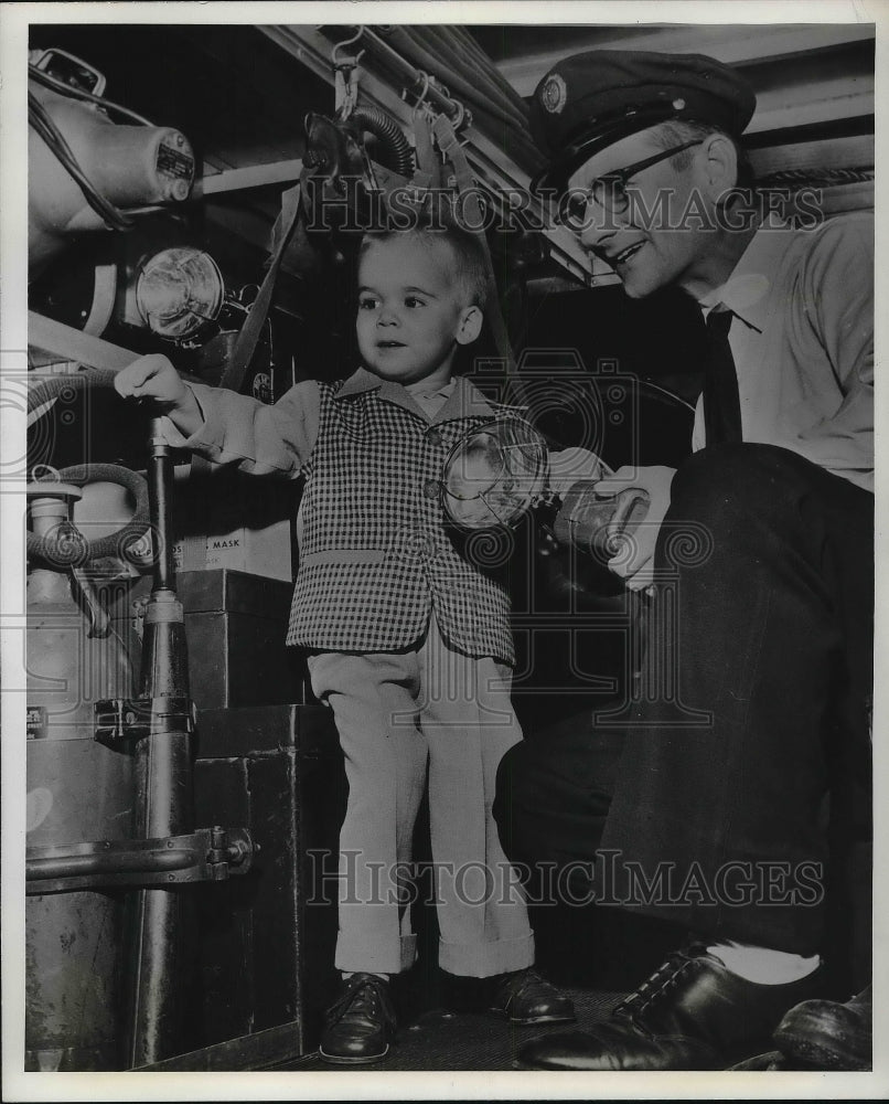 1958 Little Christopher examing the Ambulance after his ride - Historic Images