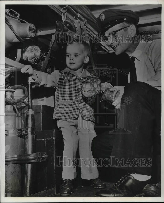 1958 Little Christopher examing the Ambulance after his ride - Historic Images