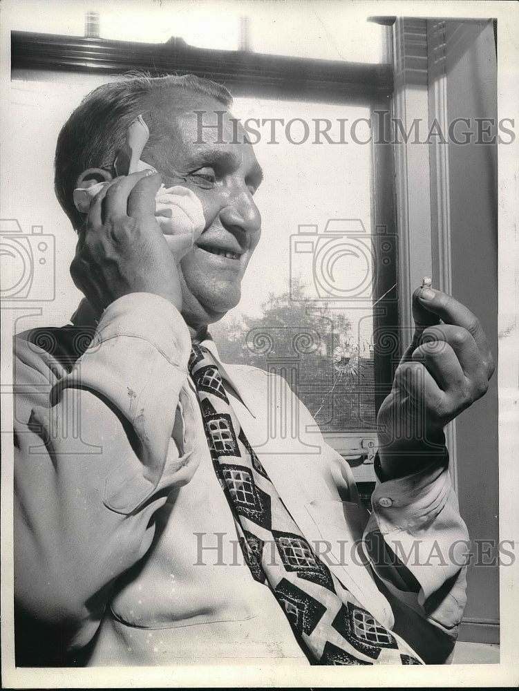 1943 Leonard Roren almost victim as boys shoot at birds near window - Historic Images