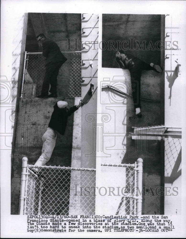 1960 Press Photo Two men and a boy sneak in Candlestick Park - Historic Images