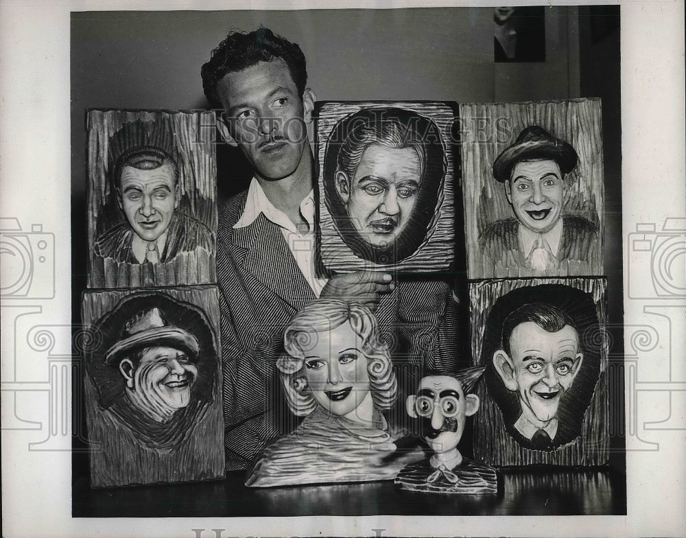 1939 Burt Johnson with Film Star Carvings from Wood - Historic Images