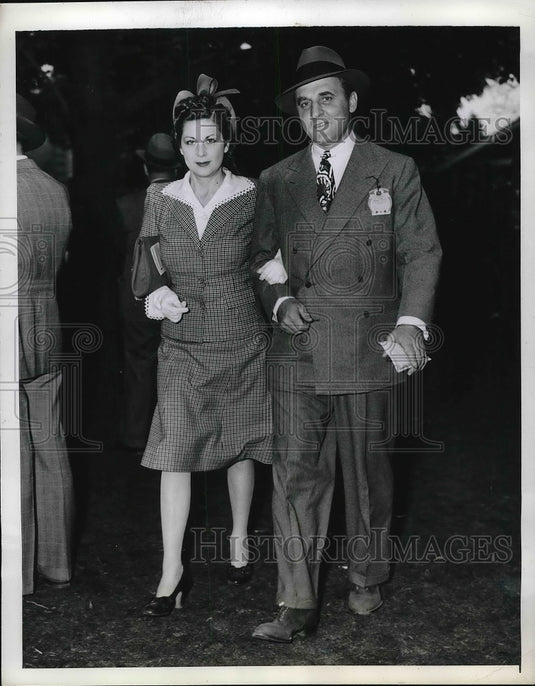1941 Mr. & Mrs. Edgar W. Garbisch attend the opening day's races at-Historic Images