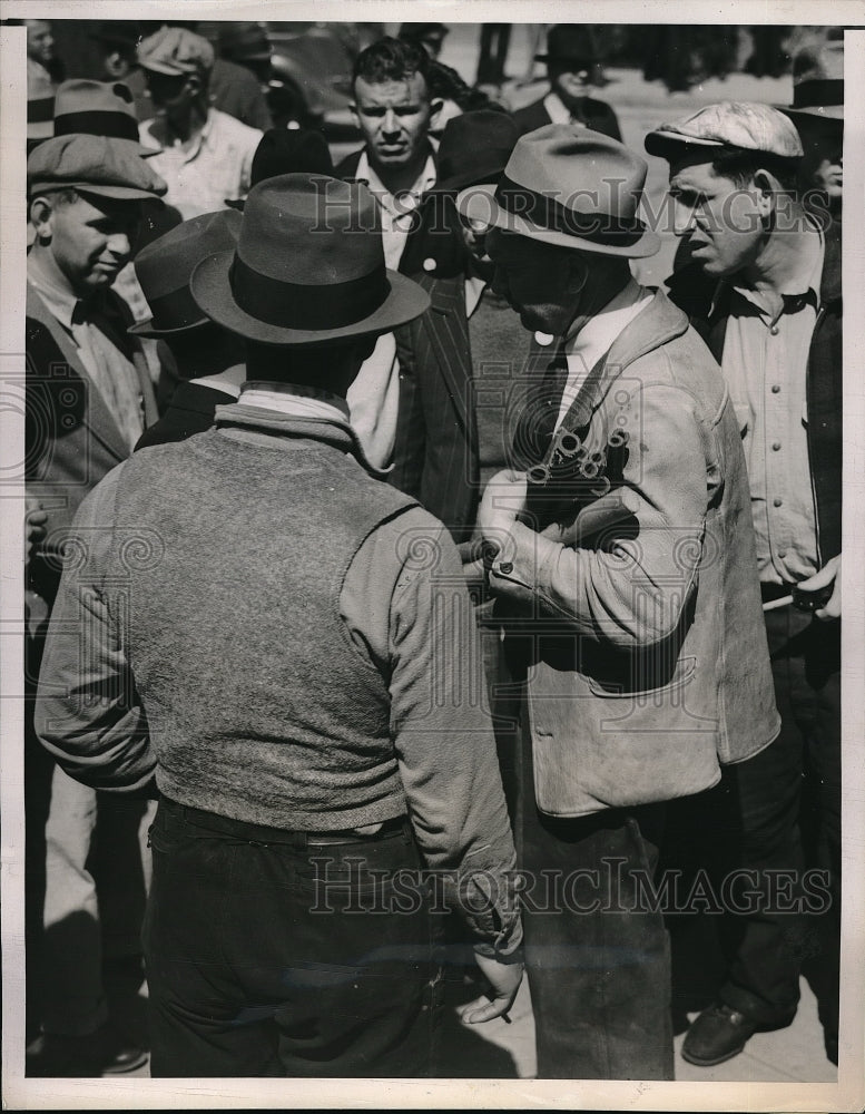 1938 Sheriff John Miller with Weapons taken from Strikers. - Historic Images