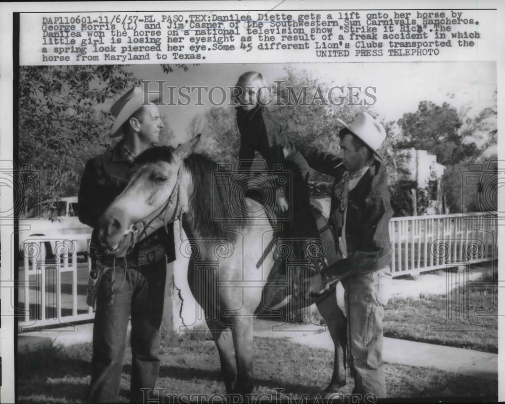 1957 Danielle Diette Lifted Onto Horse by George Morris &amp; Jim Carter - Historic Images