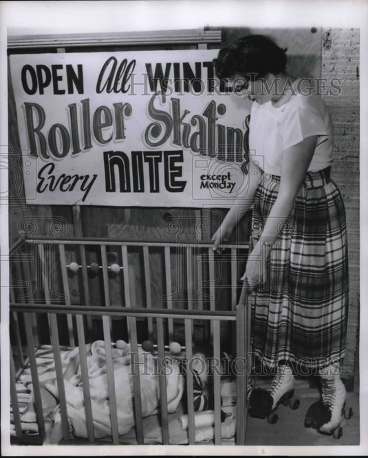 1955 Press Photo Lee de Cicci naps as Skater Mrs. Louise Varga checks on him - Historic Images
